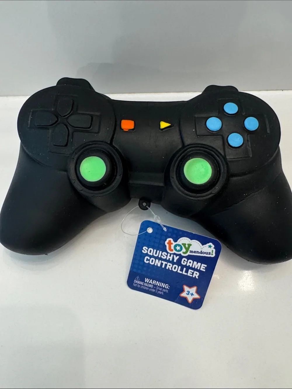 Black Squishy Game Controller Stress Toy with Green and Blue Buttons
